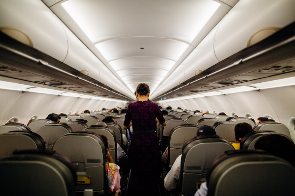 image of a woman in the middle with people sitting beside her for topic on Travel and hospitality outsourcing Philippines