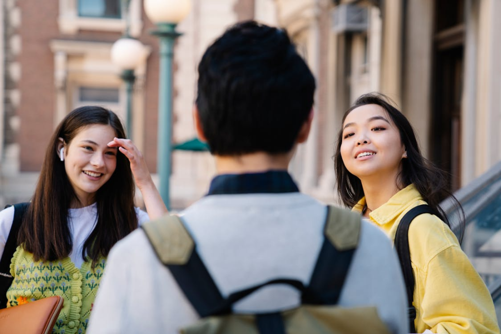 image of an international student having conversation with two other students