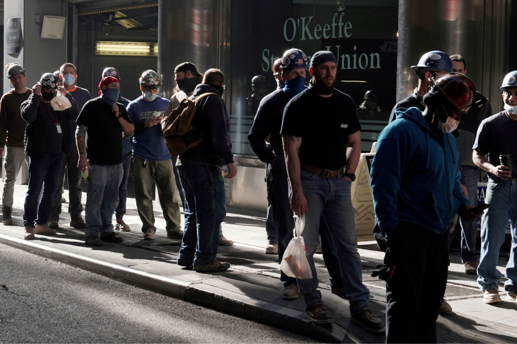 image of workers falling in line