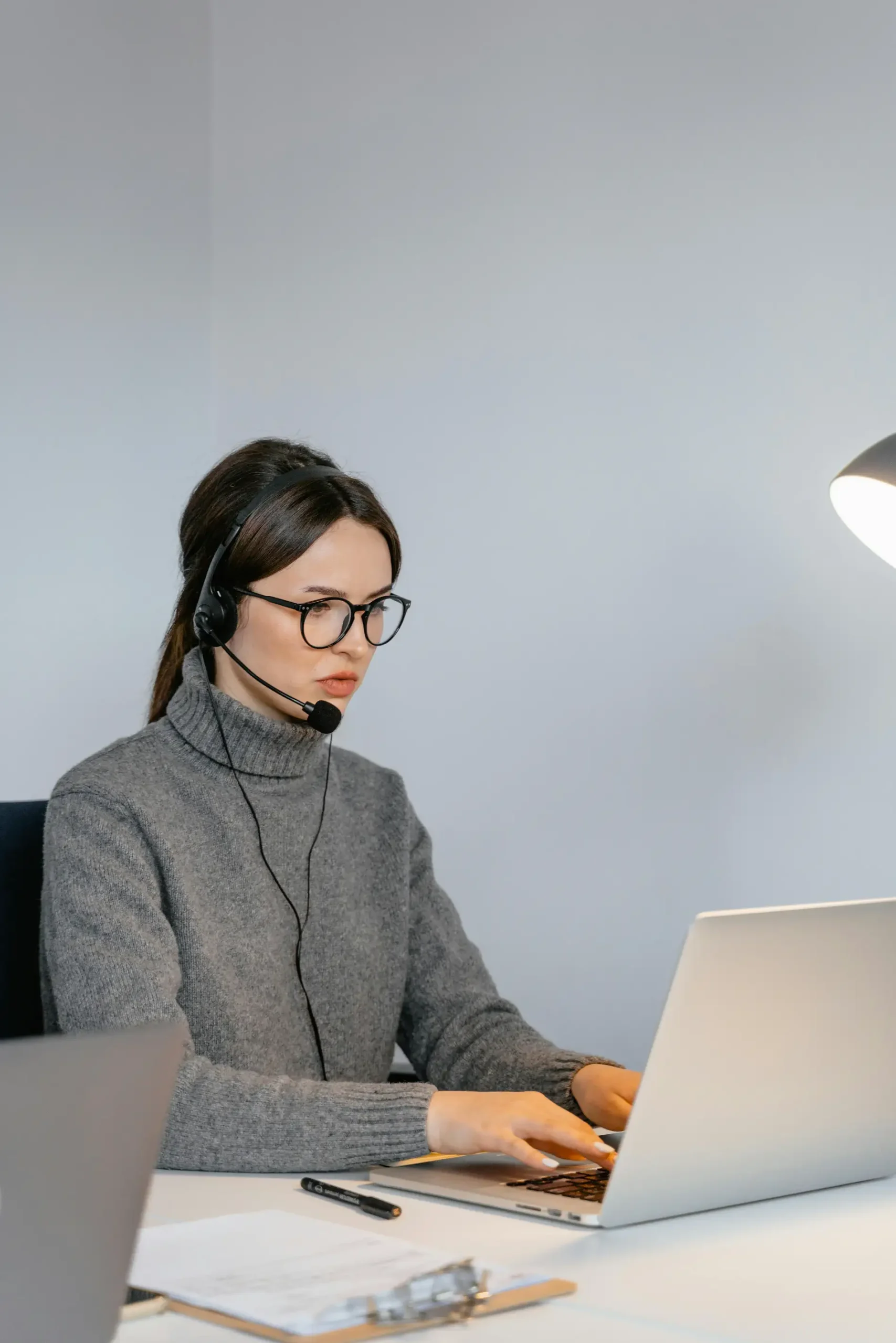 Payroll specialist calculating financial deductions and maintaining salary records