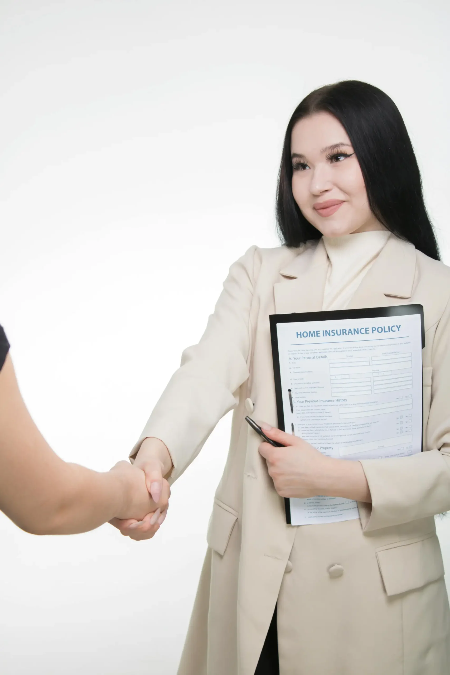 Insurance claims processor reviewing policyholder documentation and case files