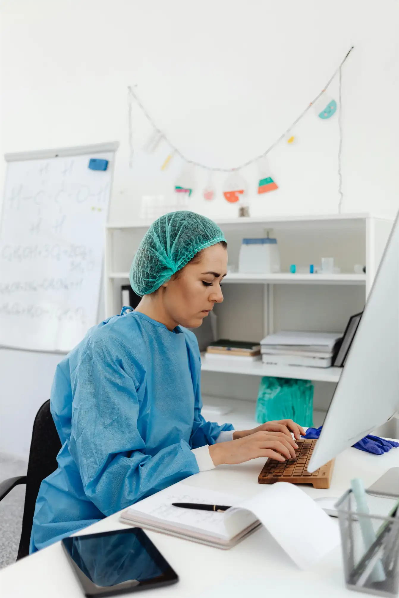 Biostatistician analyzing clinical trial datasets and preparing pharmaceutical research reports