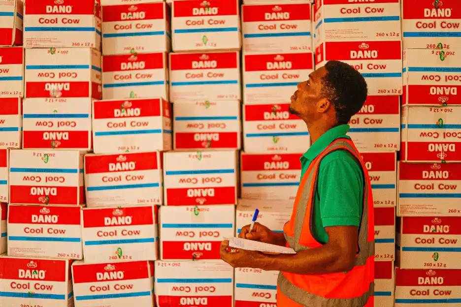Order management system specialist checking manufacturing operations