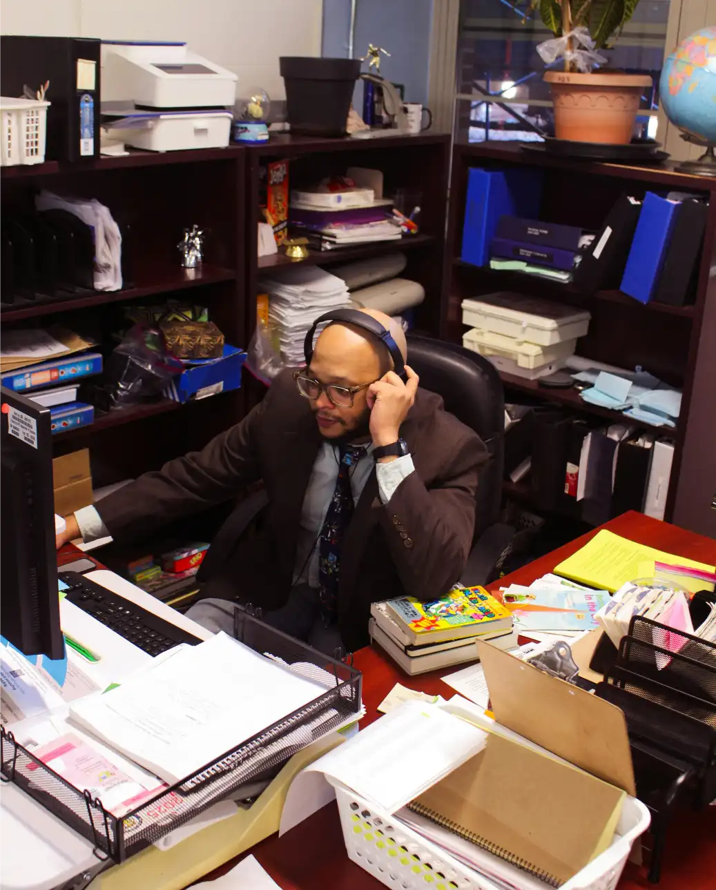 Office manager coordinating travel and hospitality operations