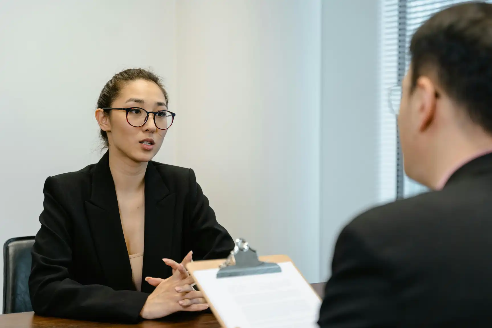 Finance Recruitment Officer coordinating interviews and sourcing candidates