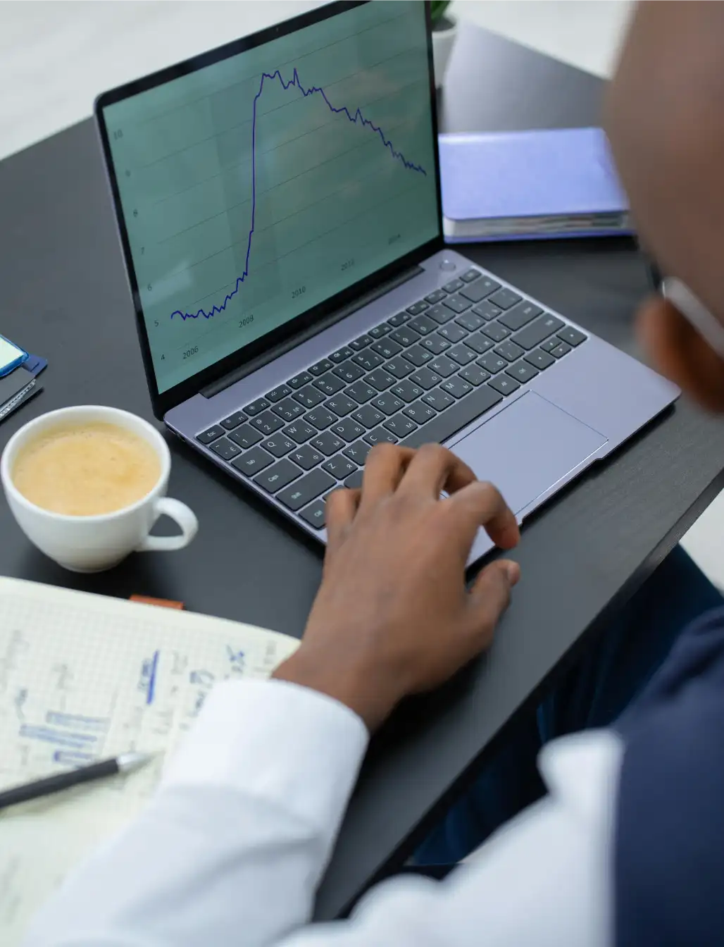 Underwriting analyst reviewing insurance applications and verifying risk data