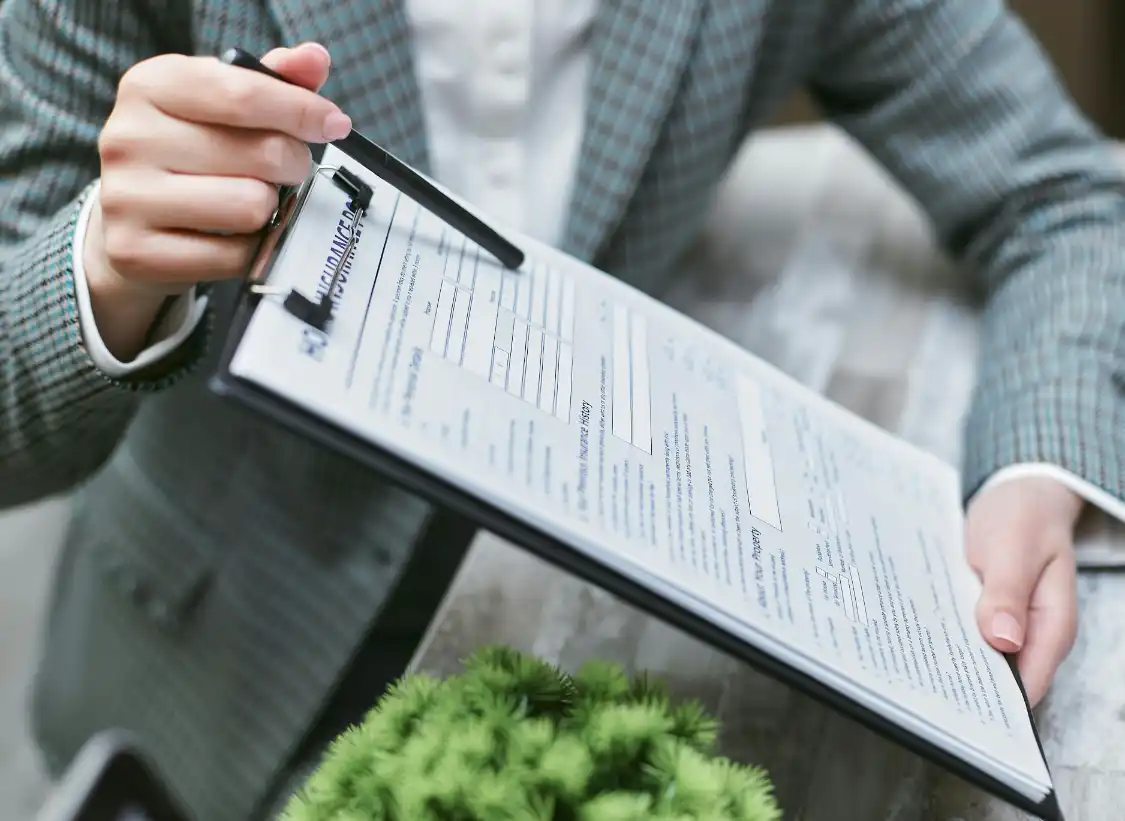 Accountant tracking insurance premiums and commission data