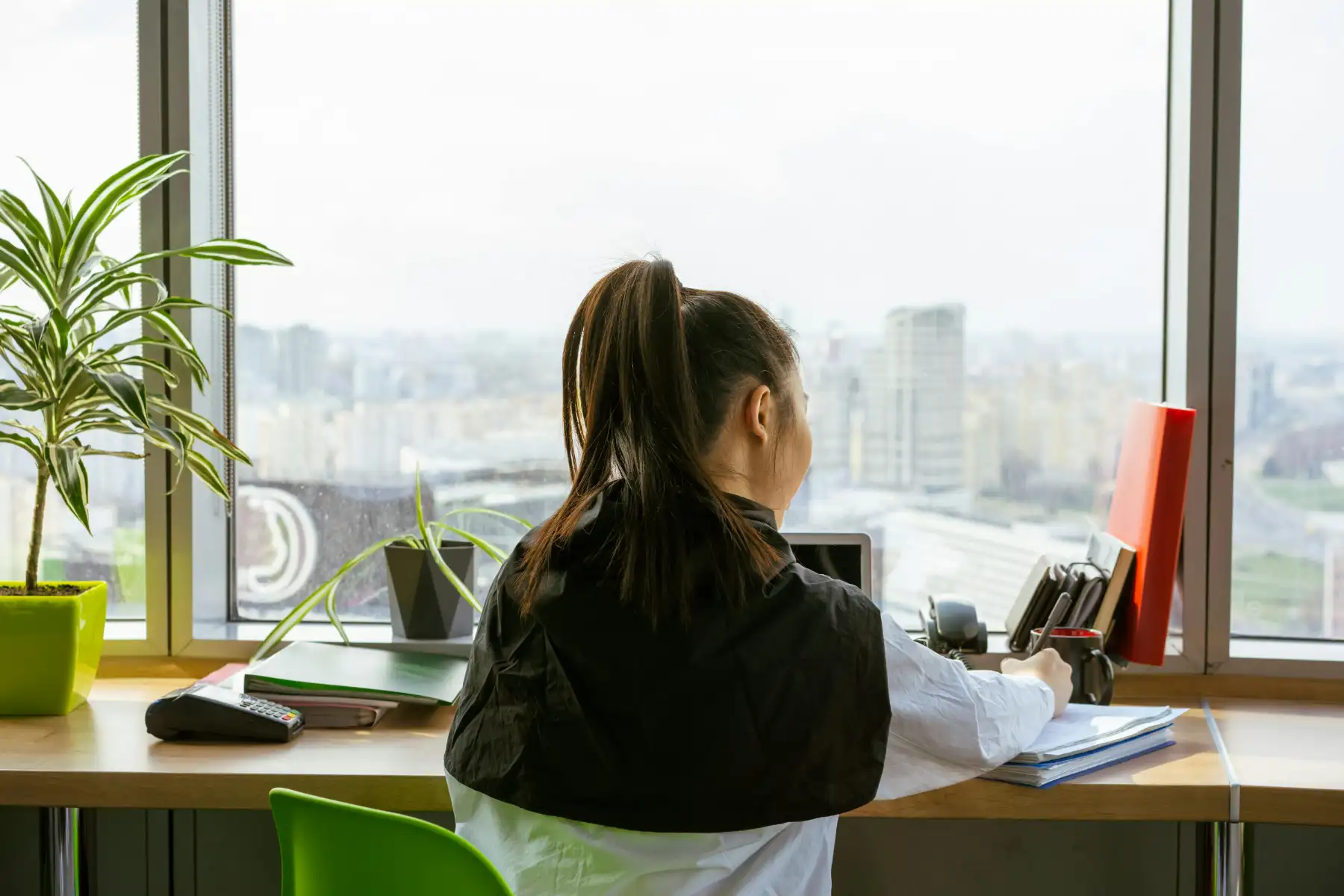Underwriting assistant preparing insurance files and reviewing application documents