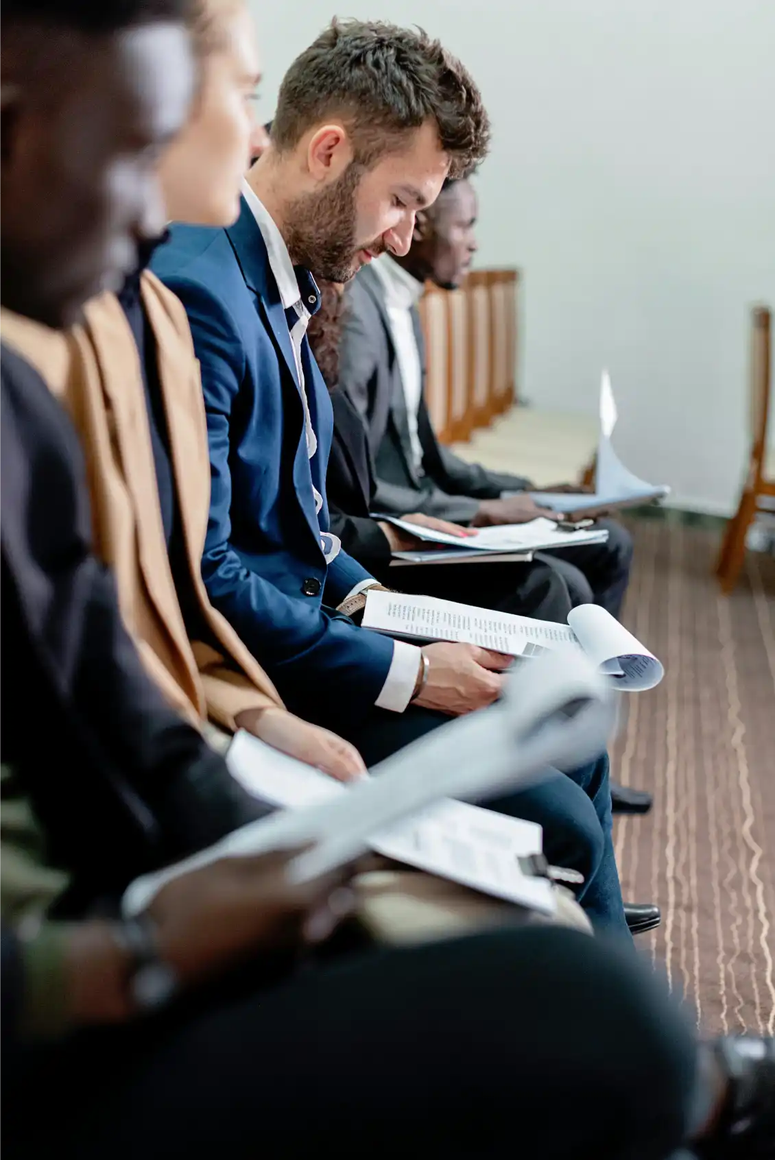 Recruitment Officer reviewing candidate profiles for insurance roles