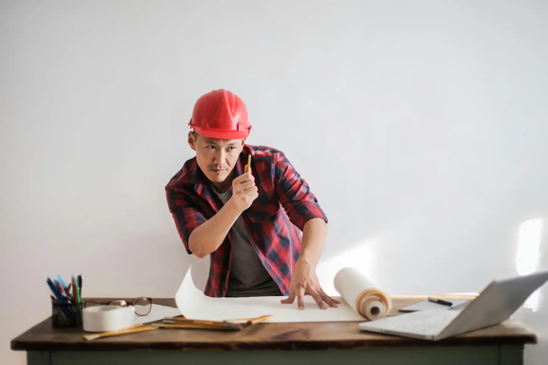 Civil Engineer reviewing construction plans