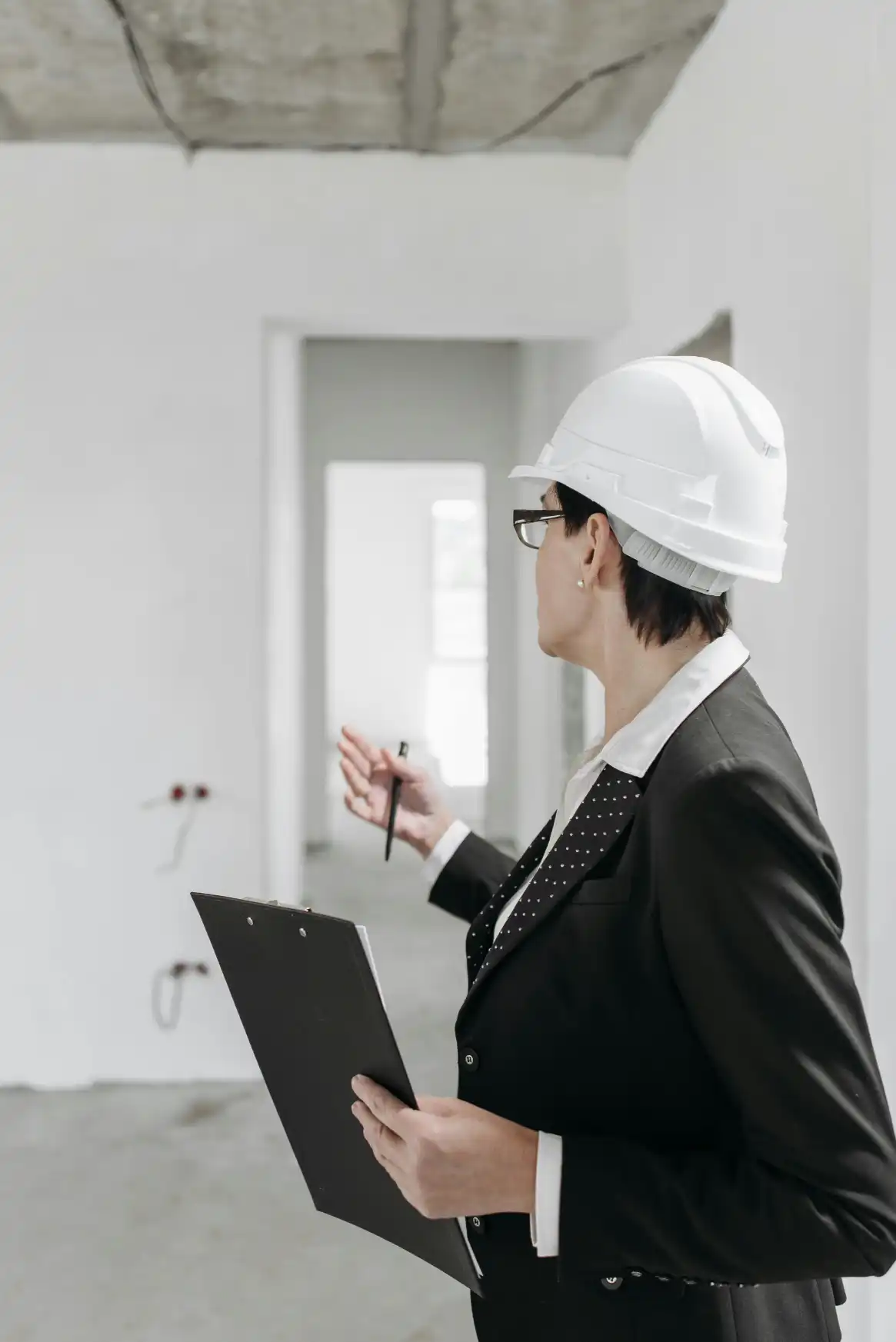Construction accountant reviewing engineering financials, job costs, and WIP trackers