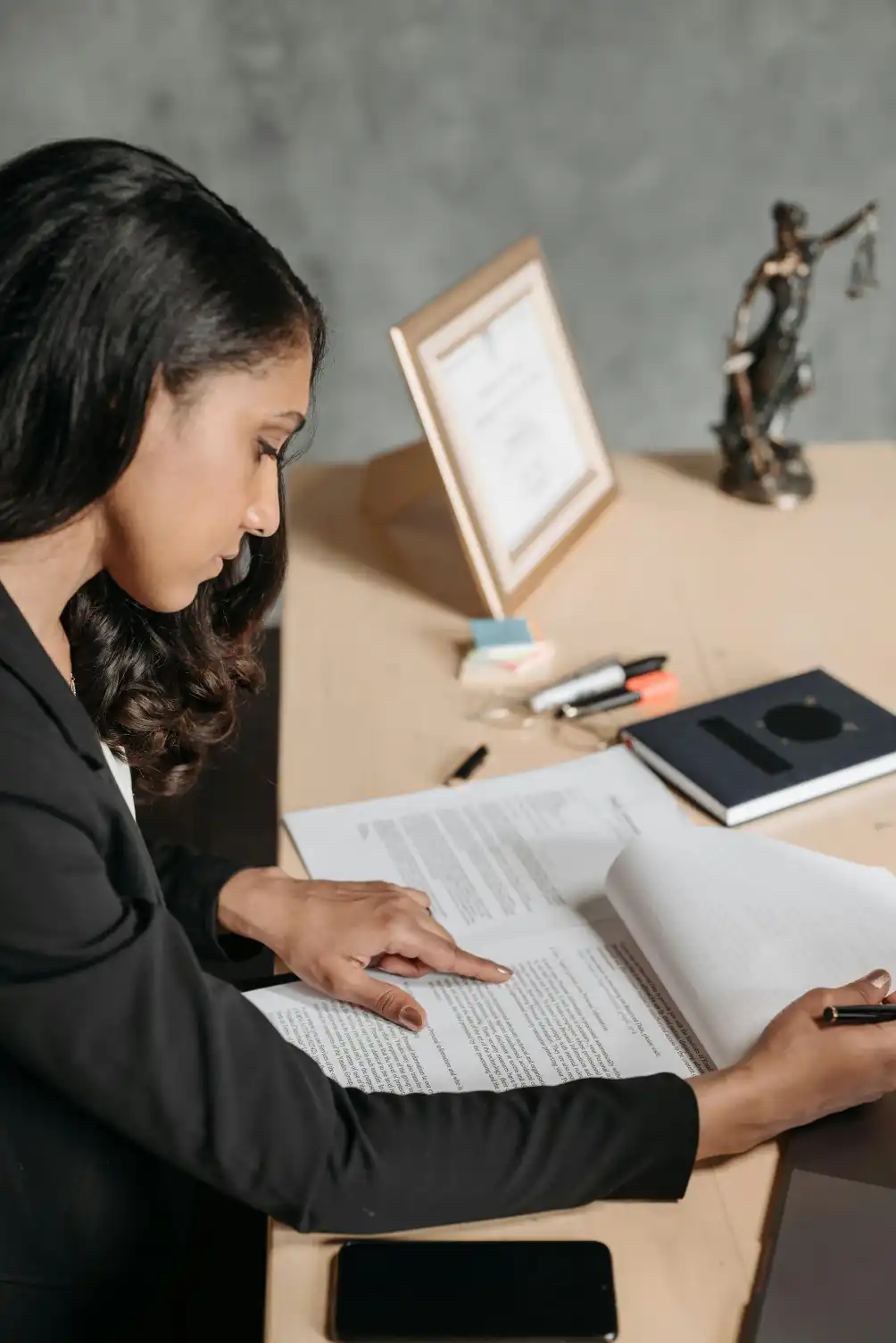 Paralegal organizing legal files and researching case documentation