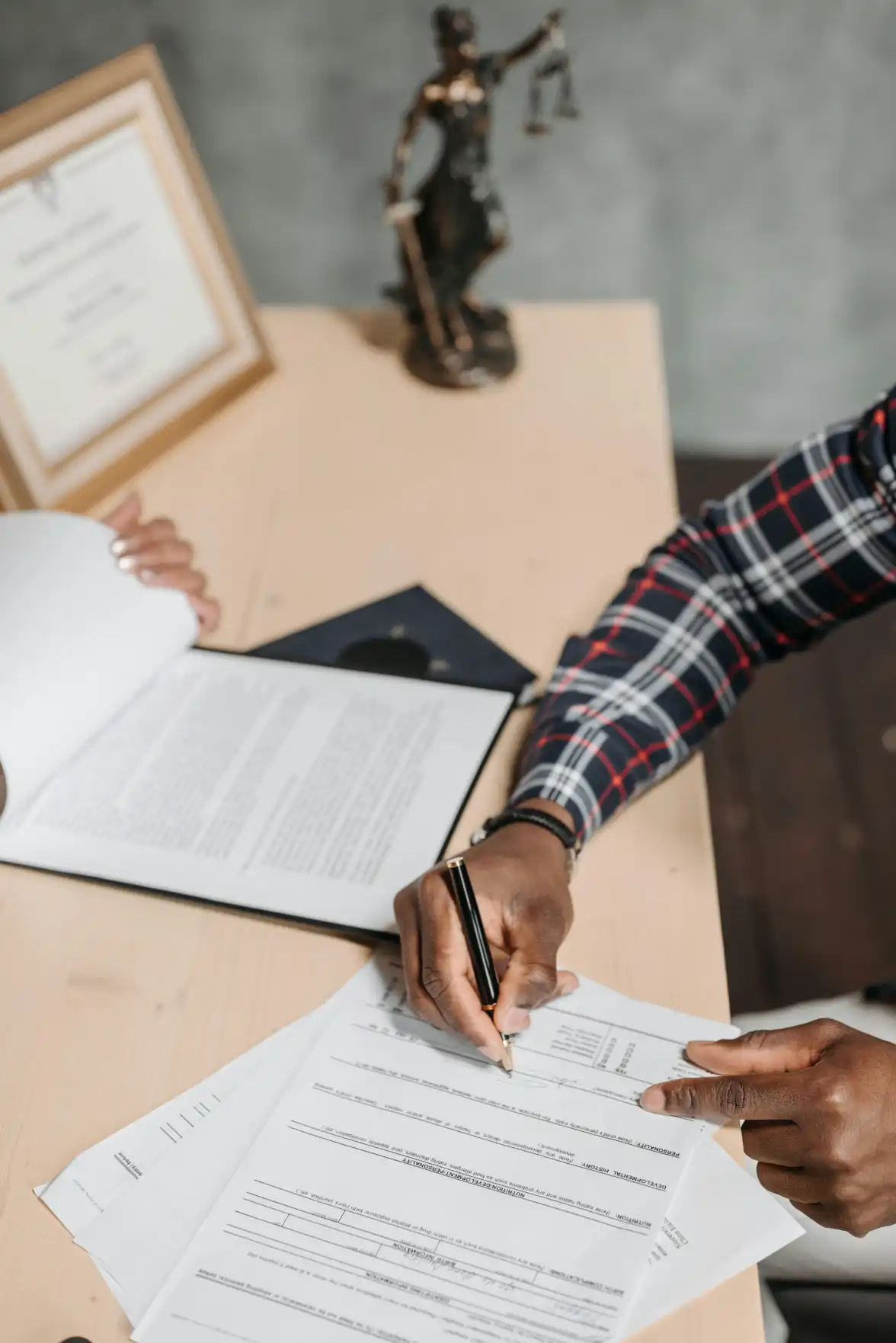 Legal Compliance Officer reviewing regulatory documents and policies