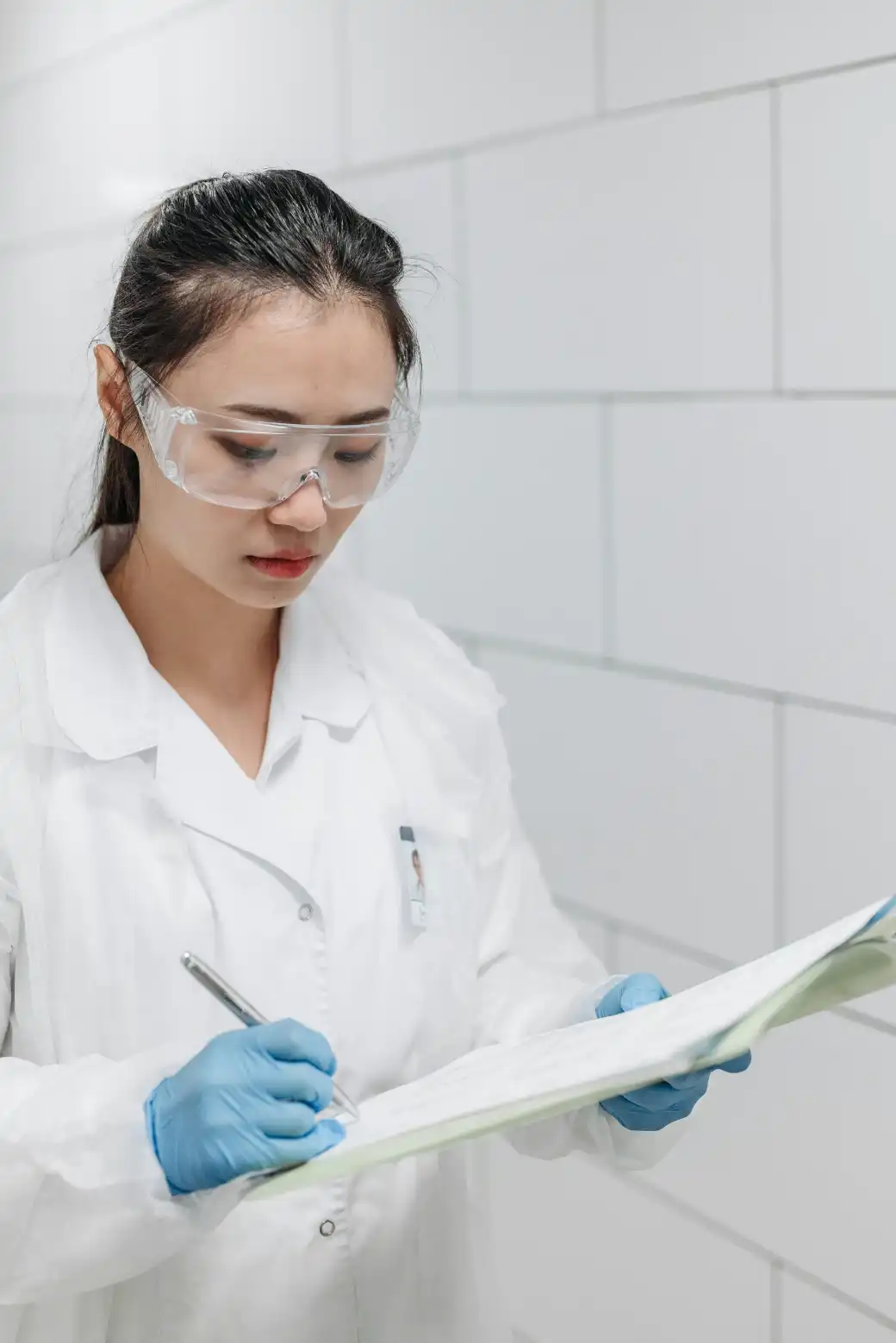 QA Officer reviewing pharmaceutical quality standards