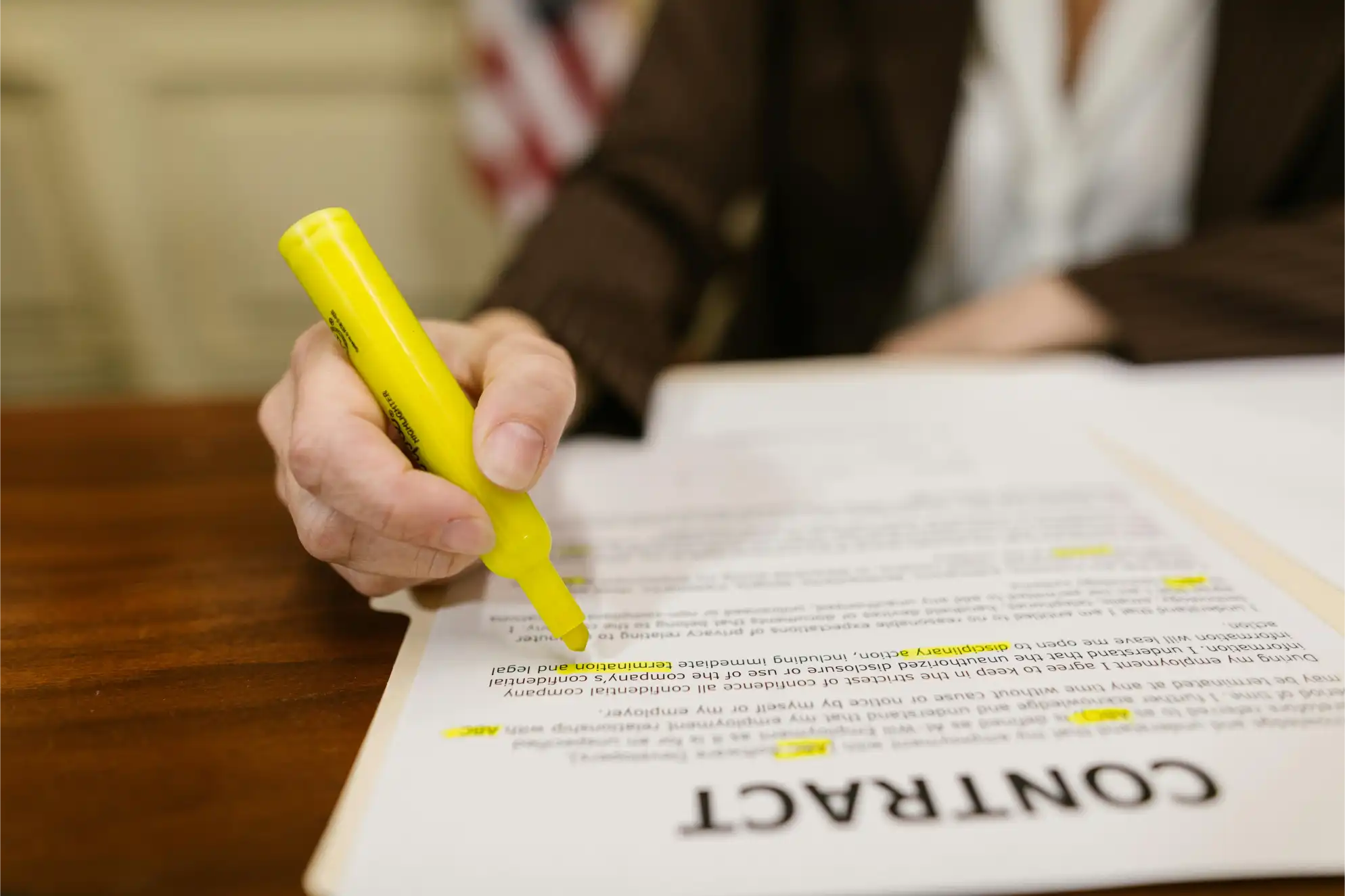 Legal Contract Administrator reviewing agreements and compliance documents