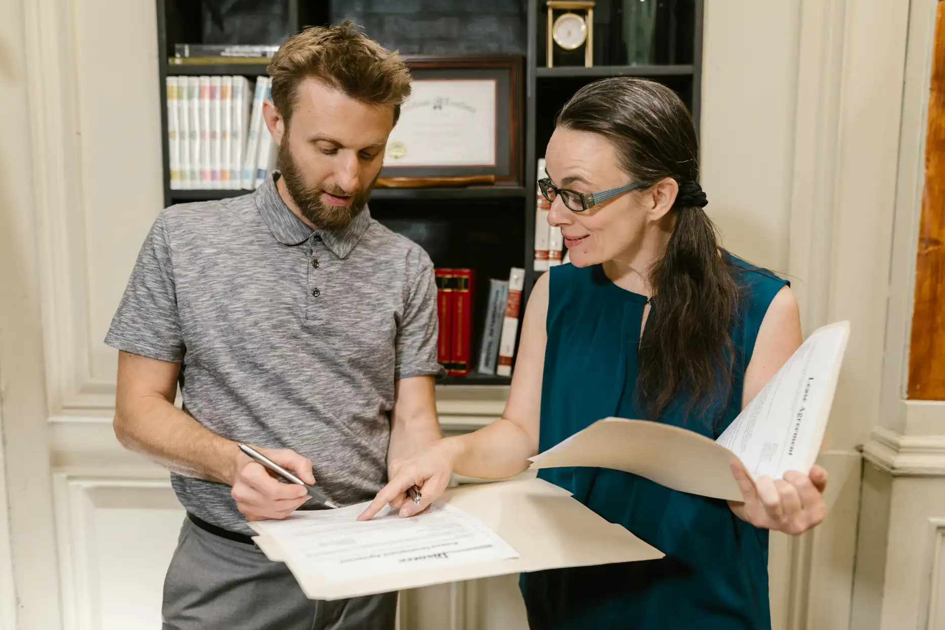 Account payable clerk reviewing financial invoices and organizing payment schedules