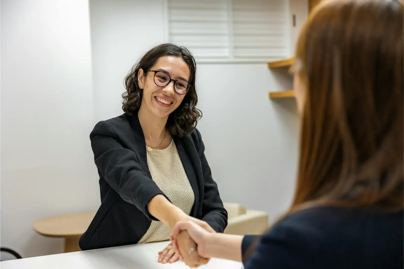 Recruitment Officer reviewing manufacturing candidate resumes